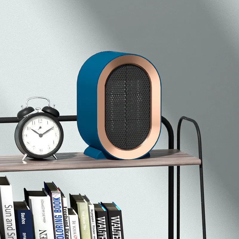 Black desktop electric fan heater with mechanical dial controls and ceramic heating technology