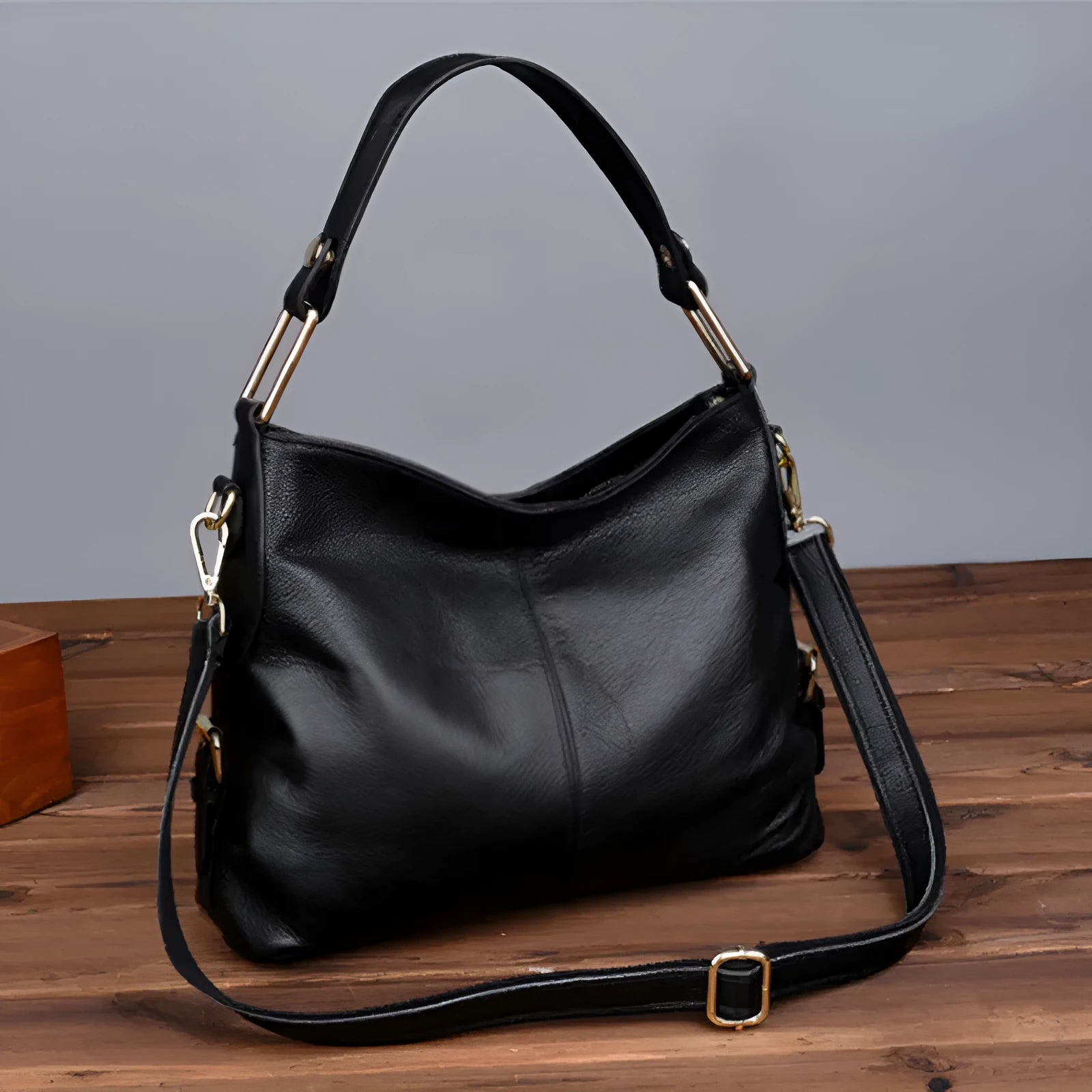 Genuine leather vertical square crossbody bag showing internal zipper compartments and external sandwich pocket