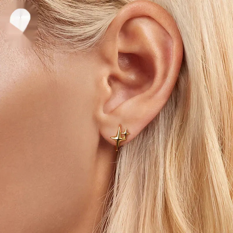 Minimalist star design clip earrings in antique-finished sterling silver