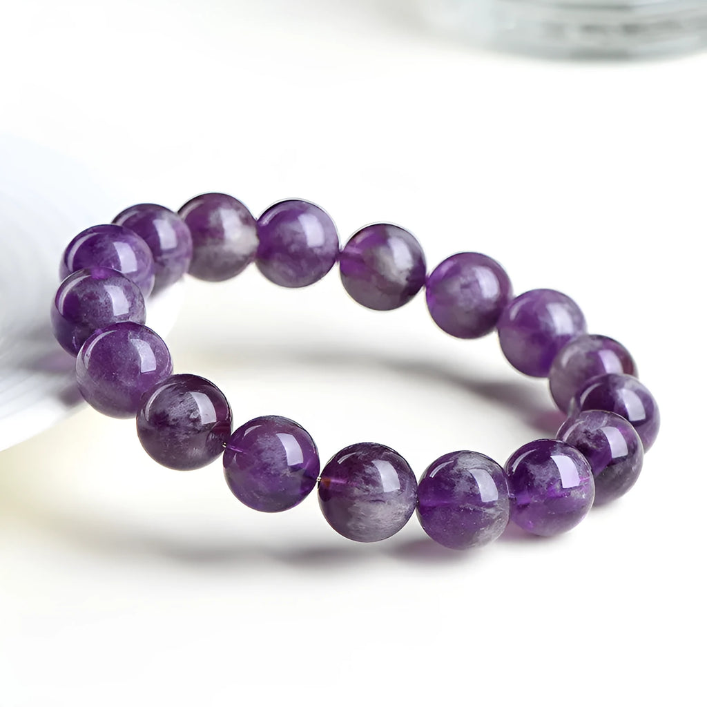 Natural feather amethyst snow mountain purple bracelet with geometric beads featuring the Ruyi symbol.