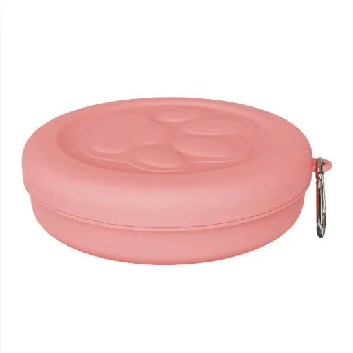 Portable outdoor dog food and water bowl with attached snack box in light pink and green colours.