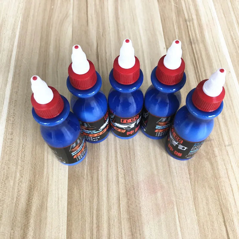 Blue automotive scratch repair agent with wiping tool for car paint restoration
