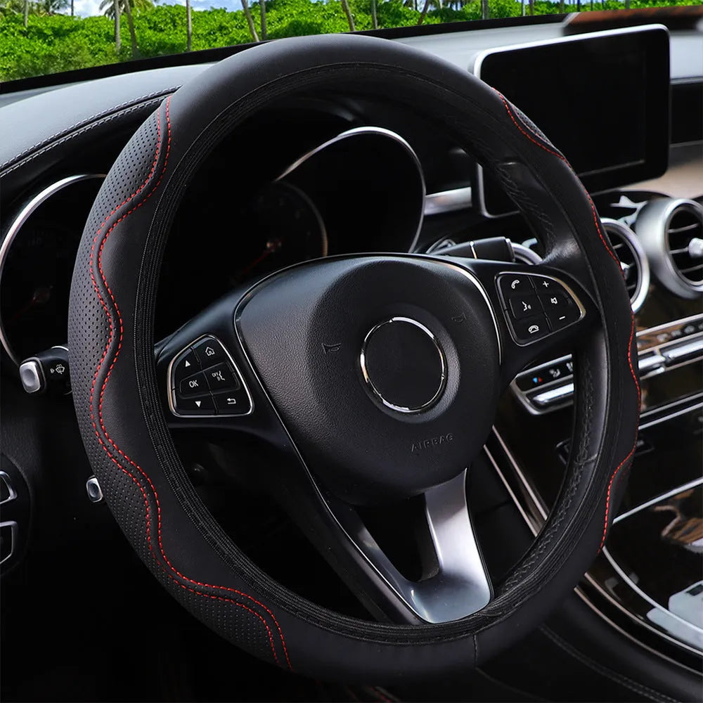 Black elastic steering wheel cover with a corrugated texture, stretched to show its fit.