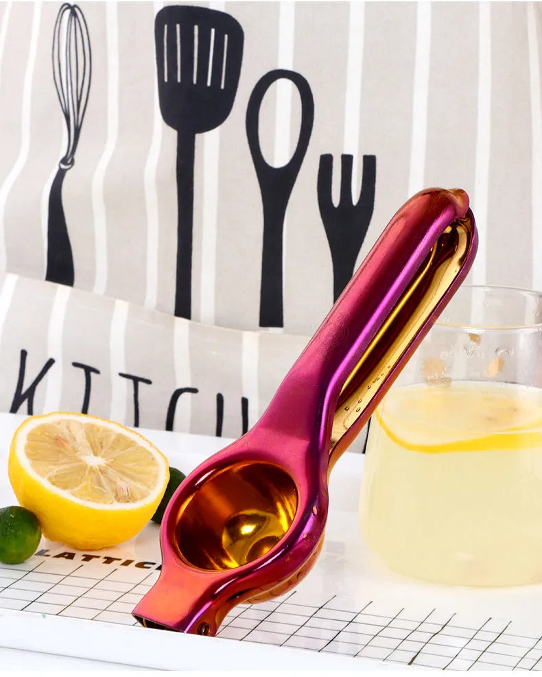 Manual stainless steel juicer Chinese style with metal body and round feed opening in gold finish