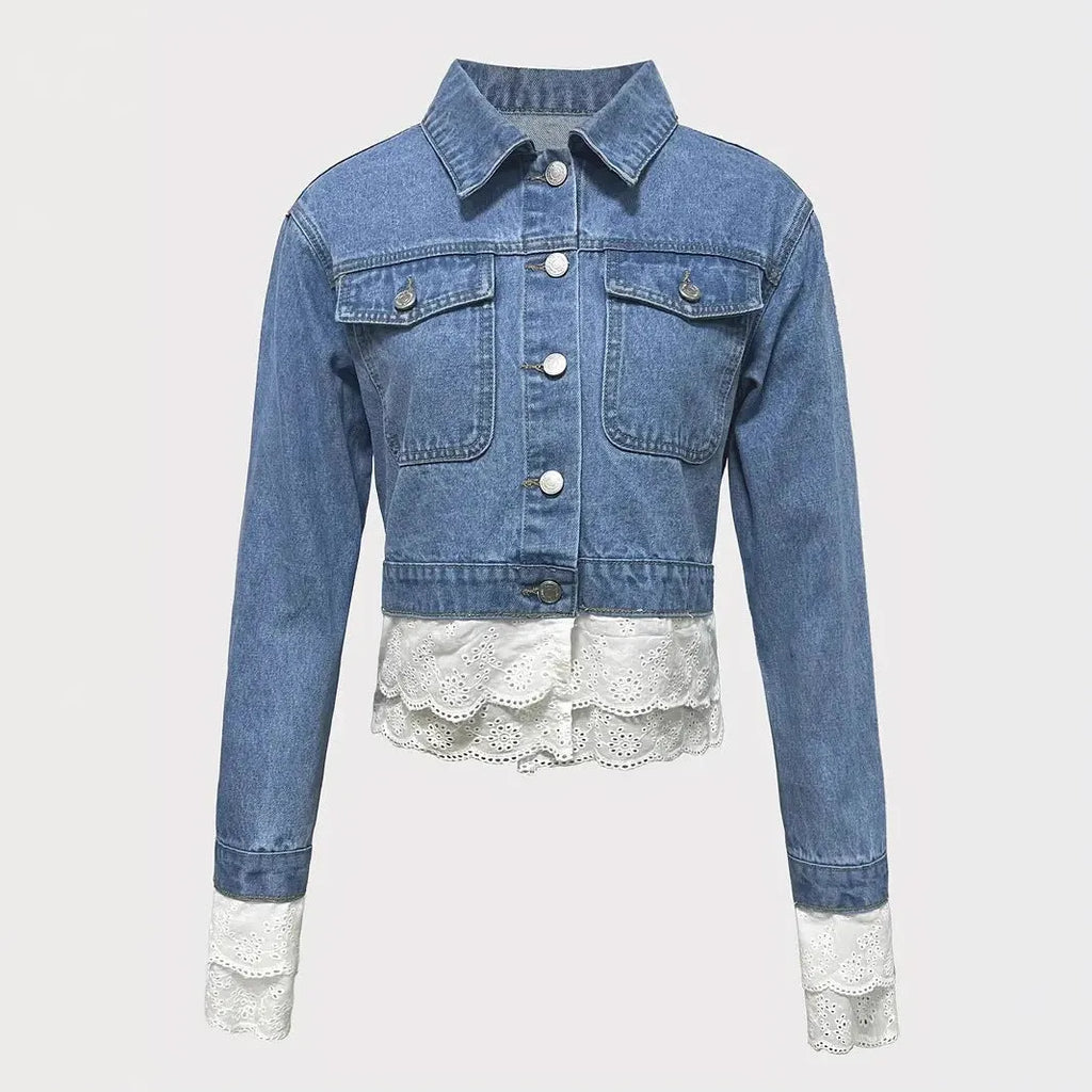 Blue women's denim jacket with lace stitching detail on the sleeves and front, featuring long sleeves.