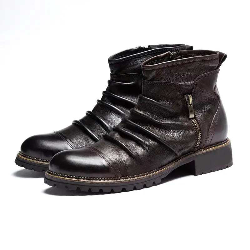 Black side zip Martin boots with round toe and medium heel on a plain background.