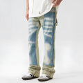 Yellow and blue retro patchwork distressed jeans on a model