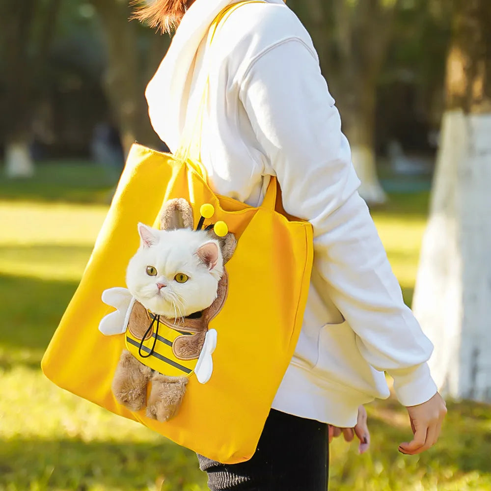 Soft canvas pet shoulder bag with cartoon pattern for small dog or cat carrier.