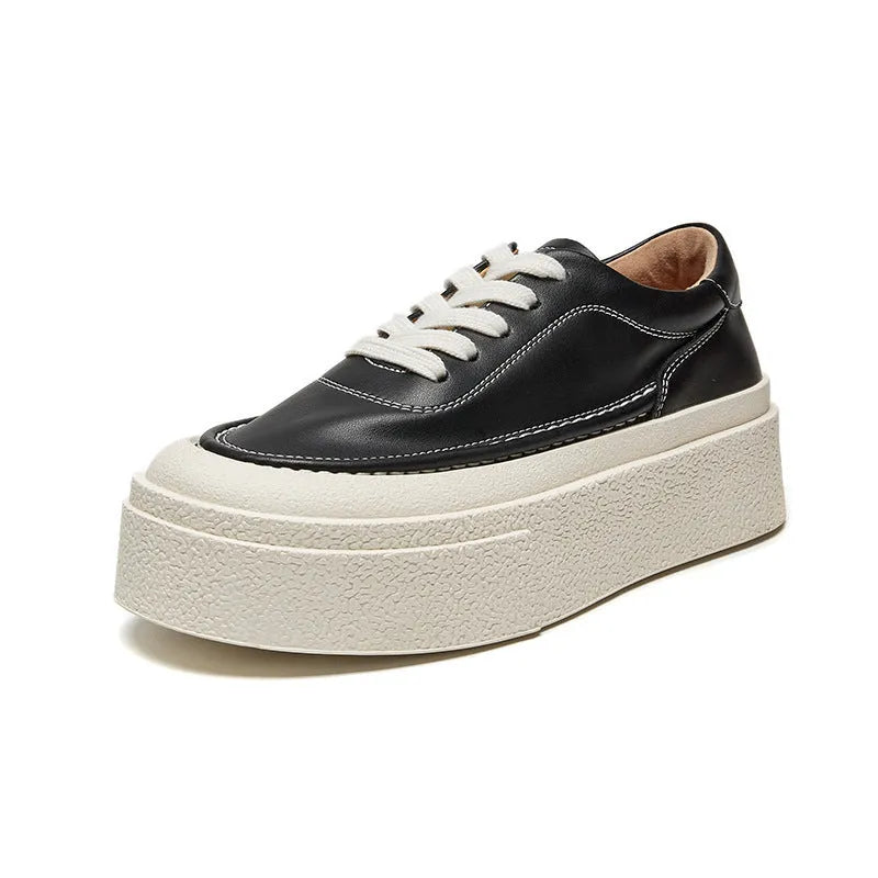 Women's black platform sports shoes with embossed cowhide upper and rubber sole, tied design detail