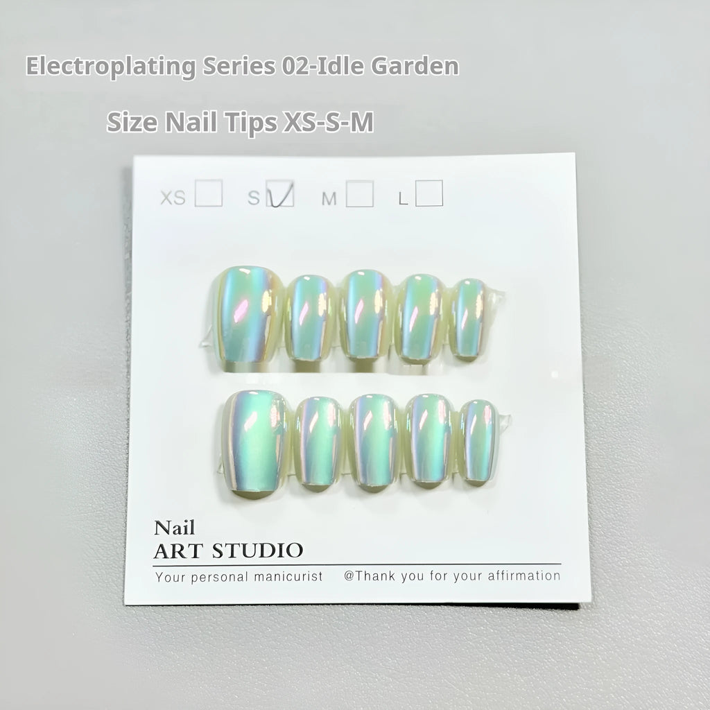 Set of electroplated Cat's Eye press-on false nails in short ladder length on a nail wheel.