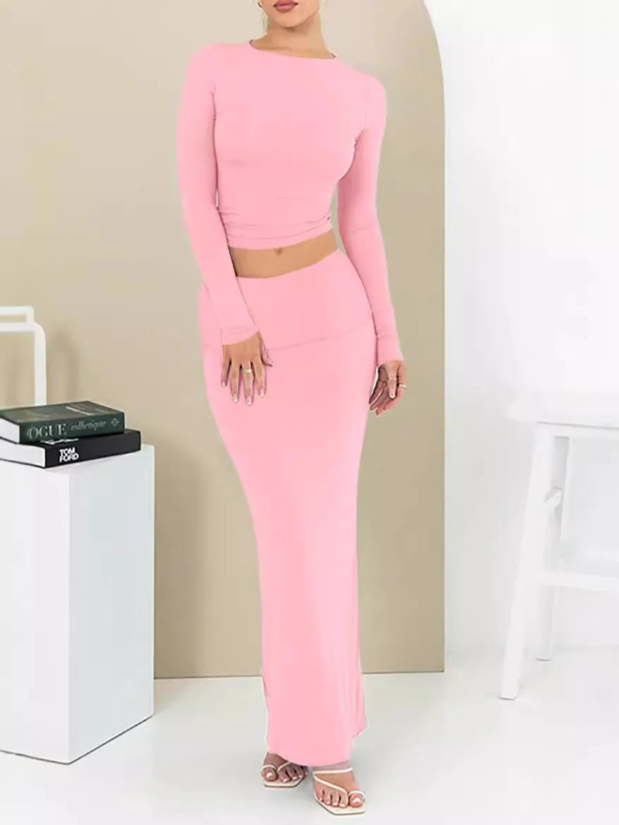 Women's black slim fit polyester two-piece suit with three-quarter sleeve top and long skirt.