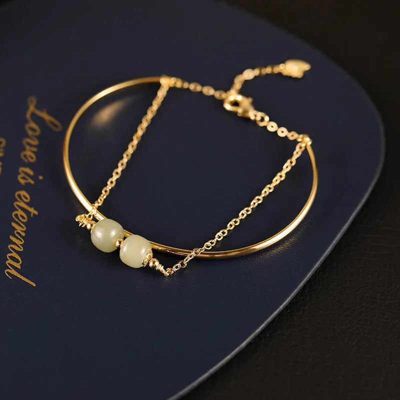 Women's jade bracelet with gold inlay detailing showing single, double and three bead versions