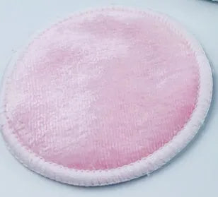 Set of eight pink and blue velvet makeup remover pads next to an organic cotton mesh drawstring bag.