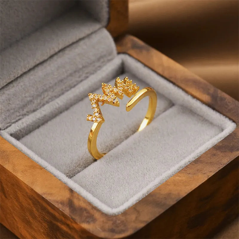 Gold electroplated copper geometric open ring in Korean fashion style, showing adjustable design.