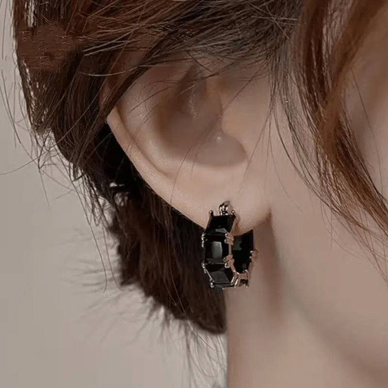 Geometric U-shaped earrings with round zircon crystals in black, pink or white with gold electroplating