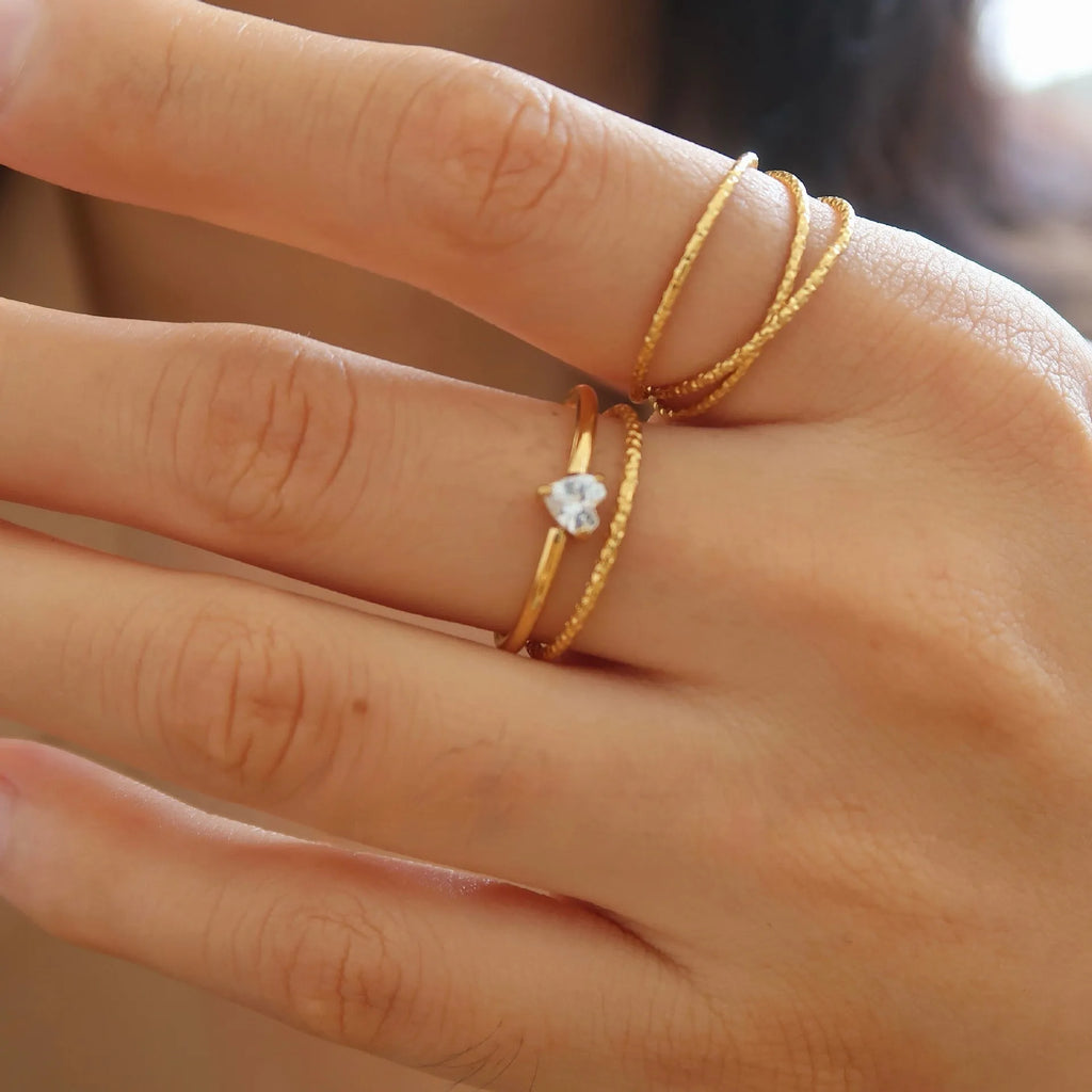 Golden electroplated stainless steel ring with love heart or oval design for women in sizes 6, 7 and 8