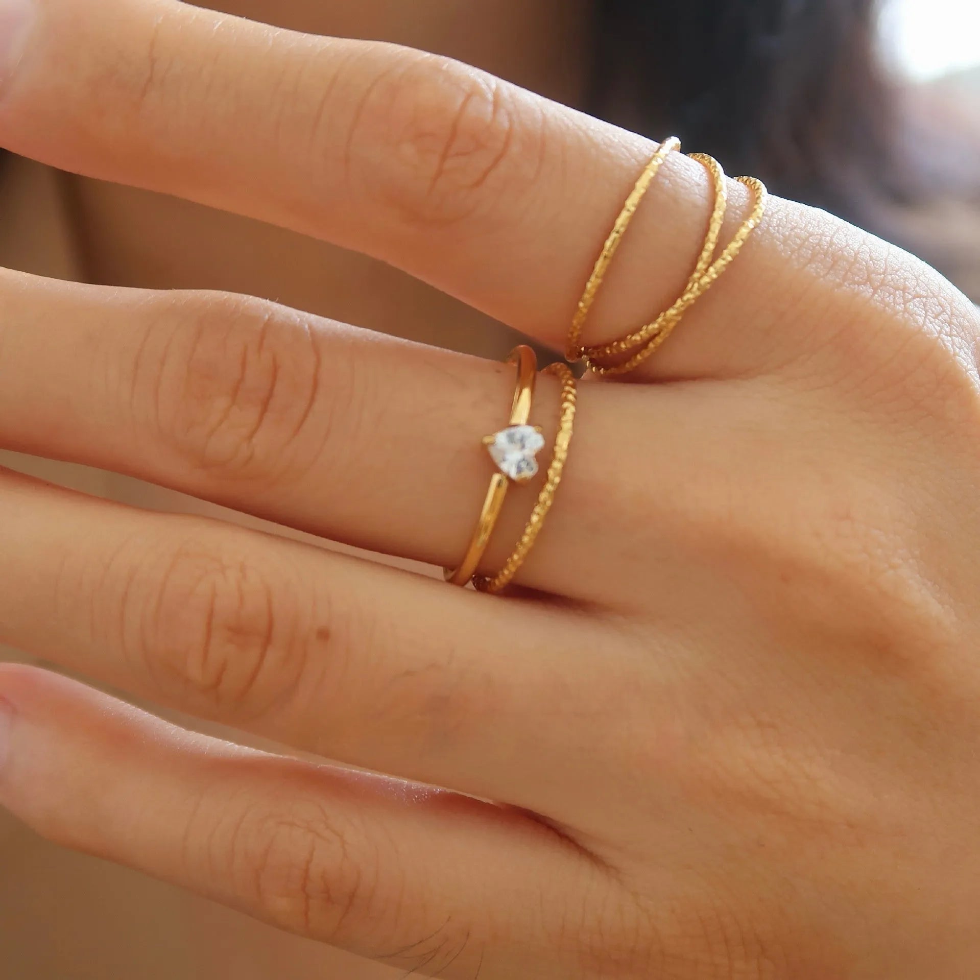 Golden electroplated stainless steel ring with love heart or oval design for women in sizes 6, 7 and 8