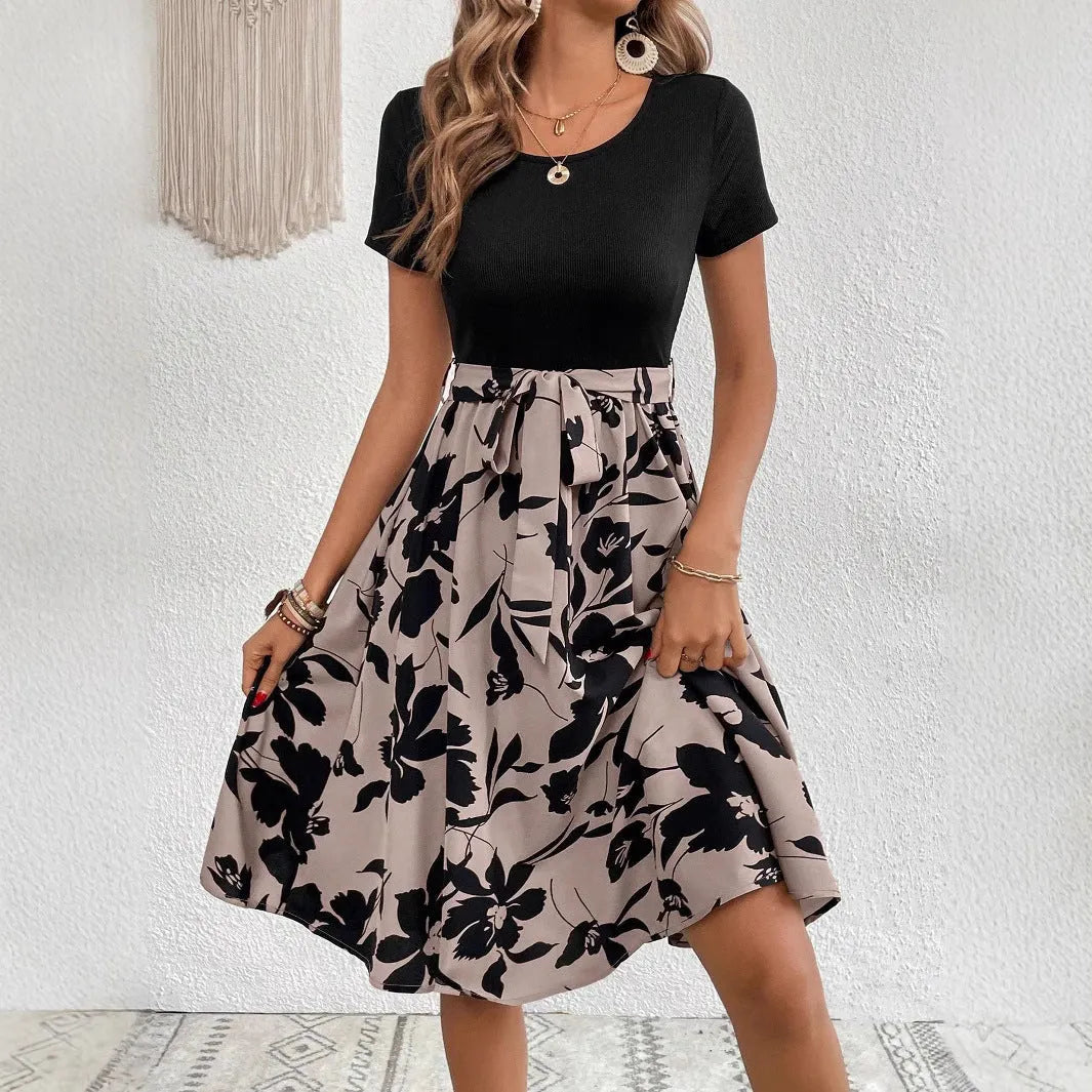 Women's khaki floral print lace-up A-line dress with shoulder straps on a hanger.