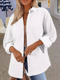 Women's solid colour long-sleeved knitted cardigan sweater in black, shown in a cardigan style.