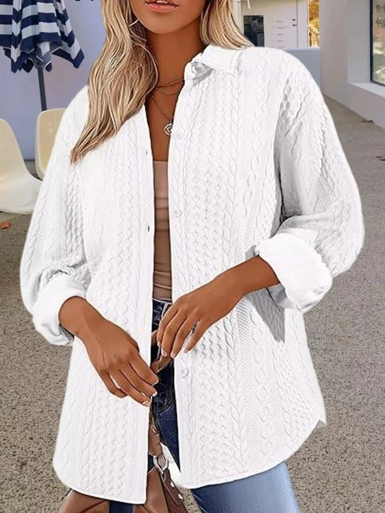 Women's solid colour long-sleeved knitted cardigan sweater in black, shown in a cardigan style.