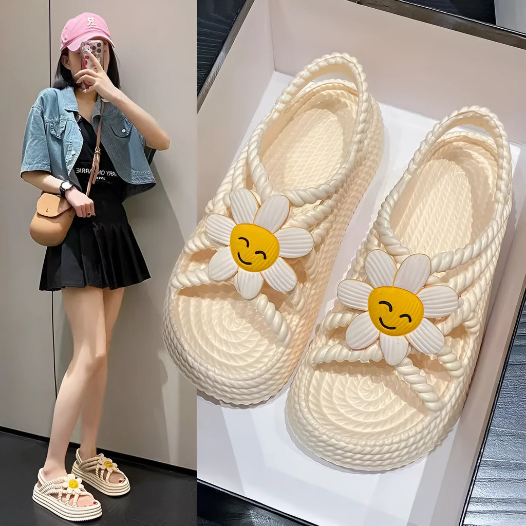 Women's beige PVC sandals with sunflower design, round toe and non-slip sole.