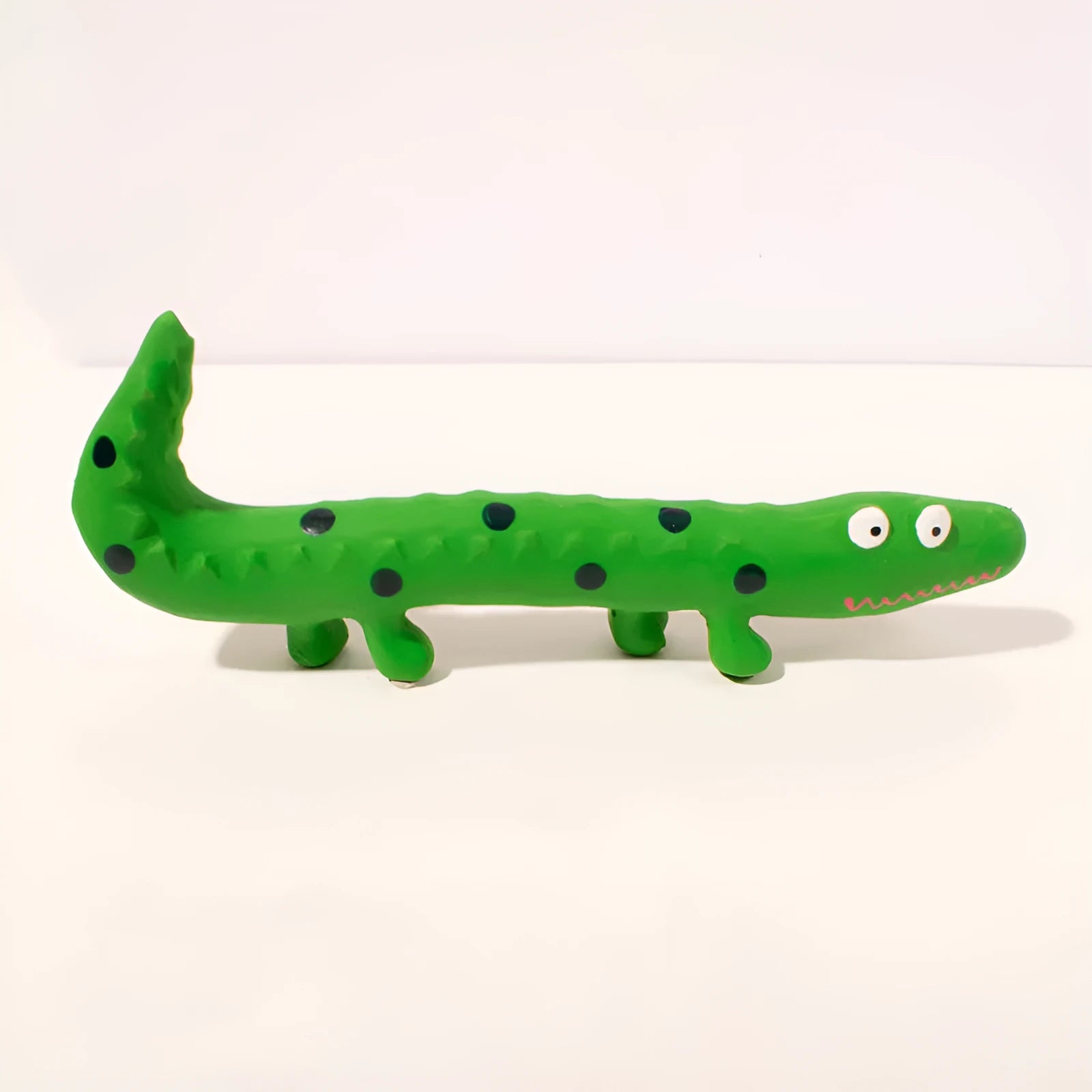 Green lizard-shaped squeaky dog chew toy with cartoon design for aggressive chewers
