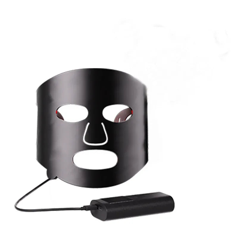 Black and white LED phototherapy face mask with controller showing seven colour light modes