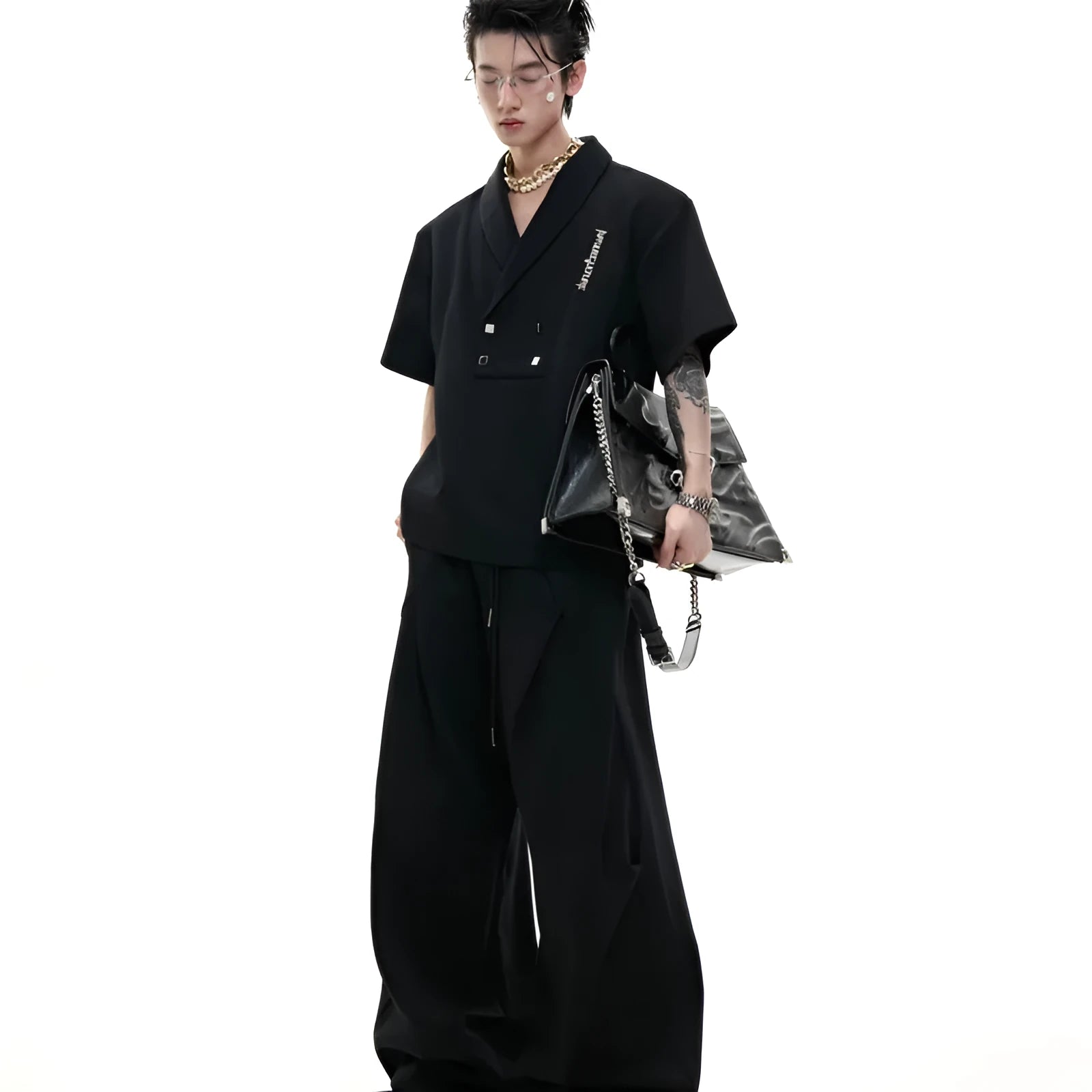 Men's dark grey V-neck sports jacket with padded shoulders and matching shorts