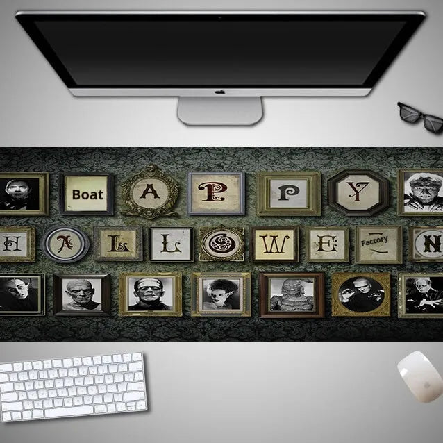Large Halloween-themed computer mouse pad with graphic design on a desk