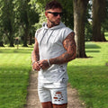 Men's cotton blend training suit set with hooded black sleeveless top and matching trousers