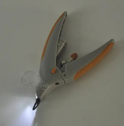 Dog nail trimmer with LED light and blood line indicator showing ABS plastic construction
