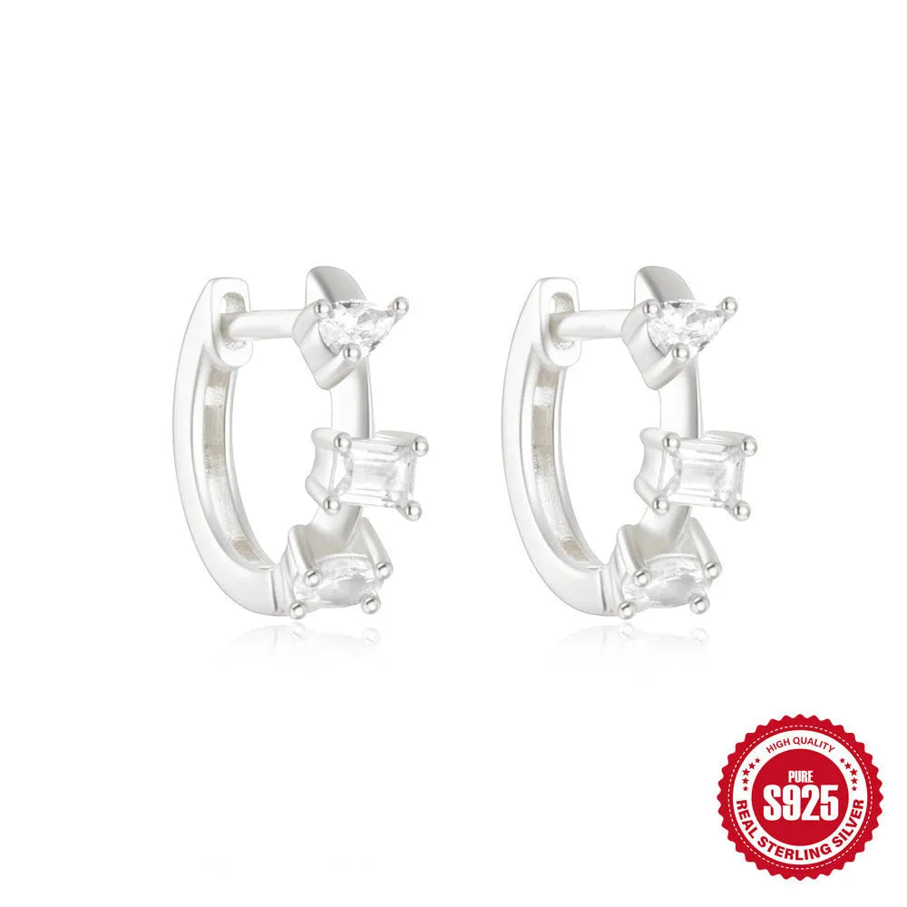 Sterling silver geometric stud earrings with small round design elements in gold or silver finish