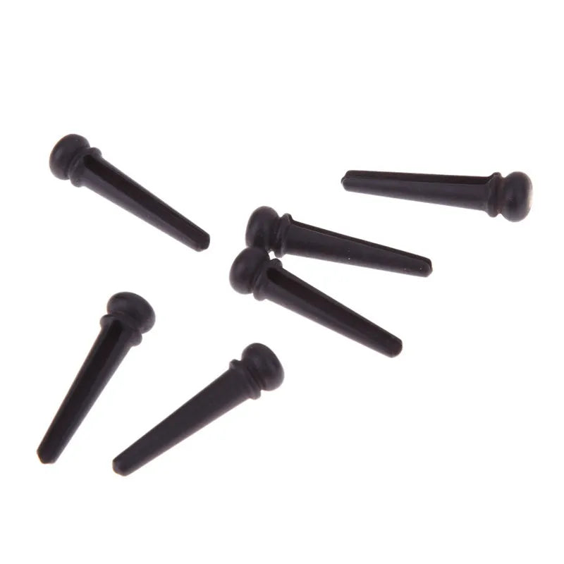 Six ebony guitar string nails with matt black finish for folk acoustic guitar bridge installation