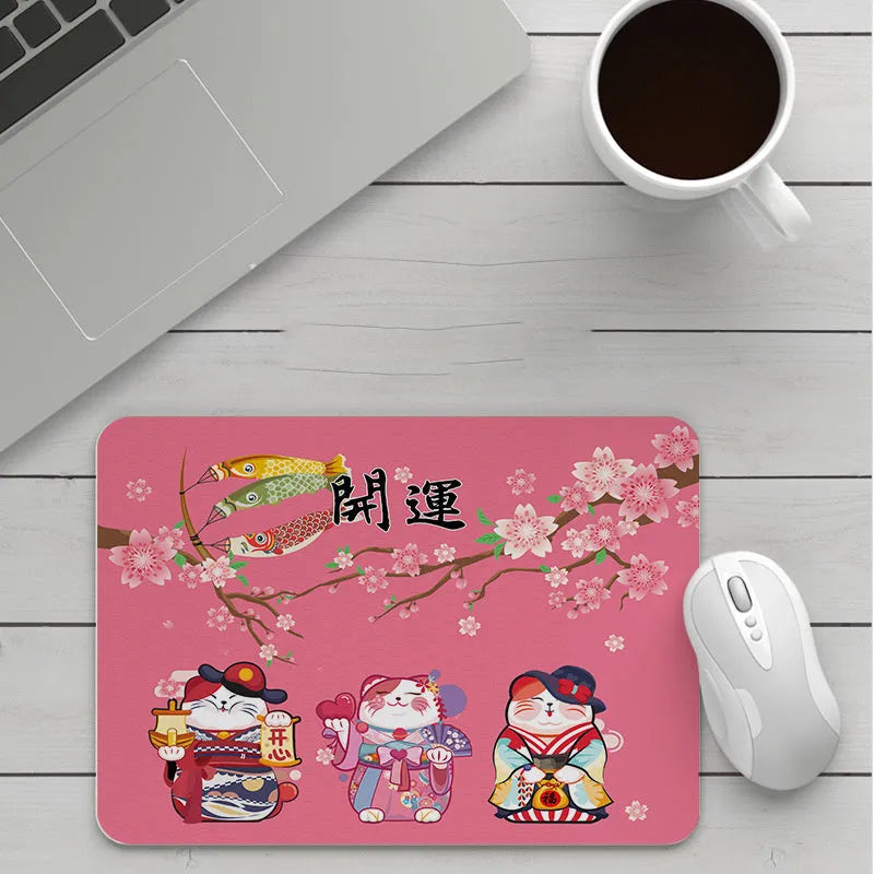 Custom cartoon thickening mouse pad on a desk, showing a colourful design with black stitched edge.