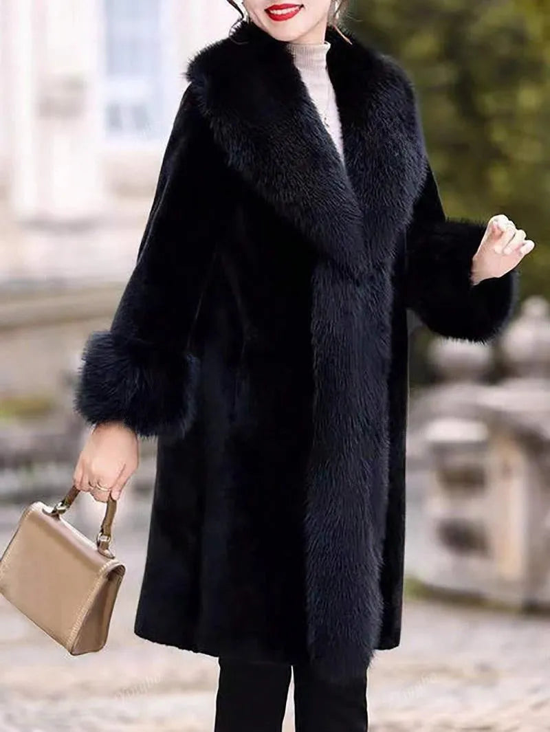 Grey women's mid-length coat with faux fur body, leather detailing, and a matching artificial fur collar.