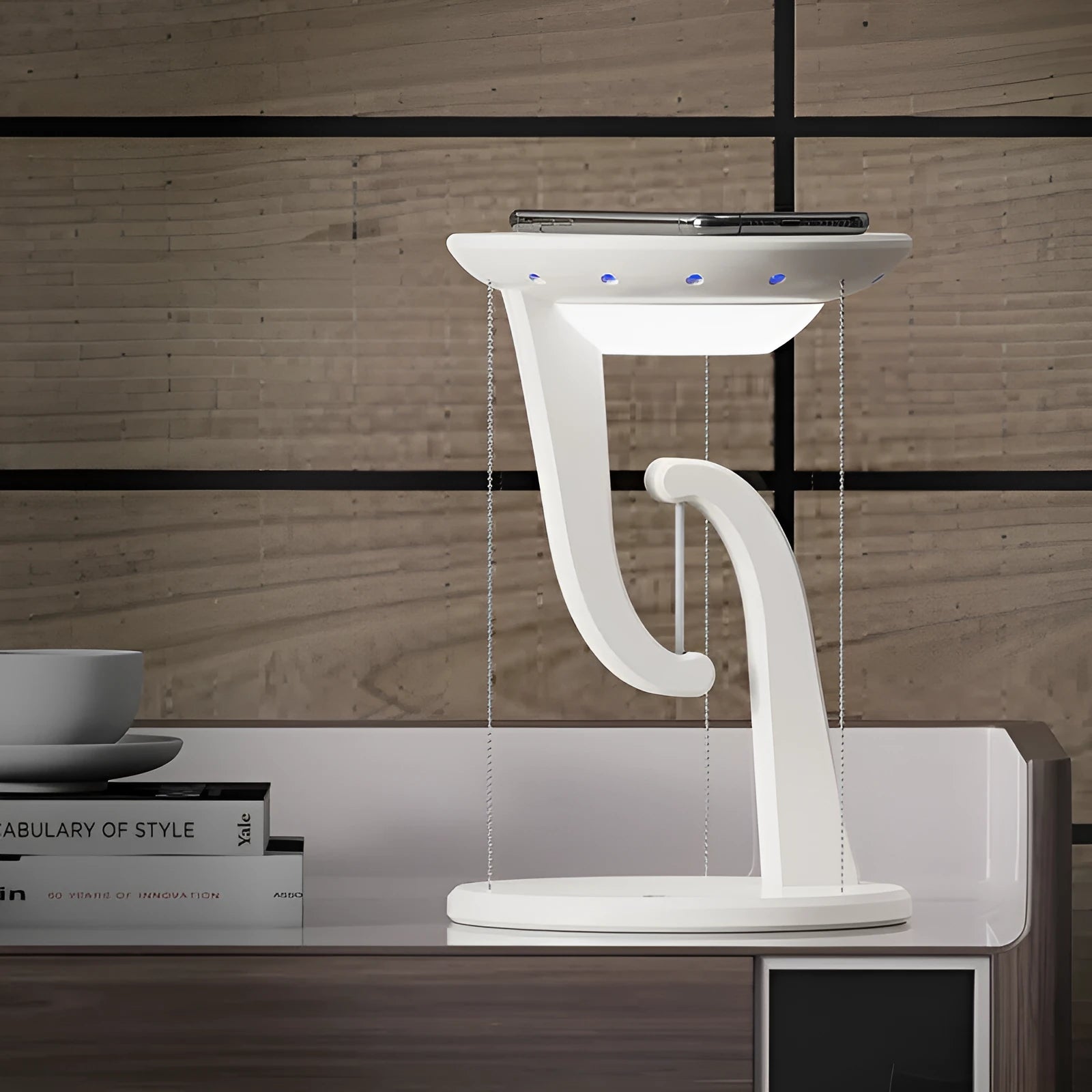 White creative smart wireless phone charger suspension lamp on desk with USB cable