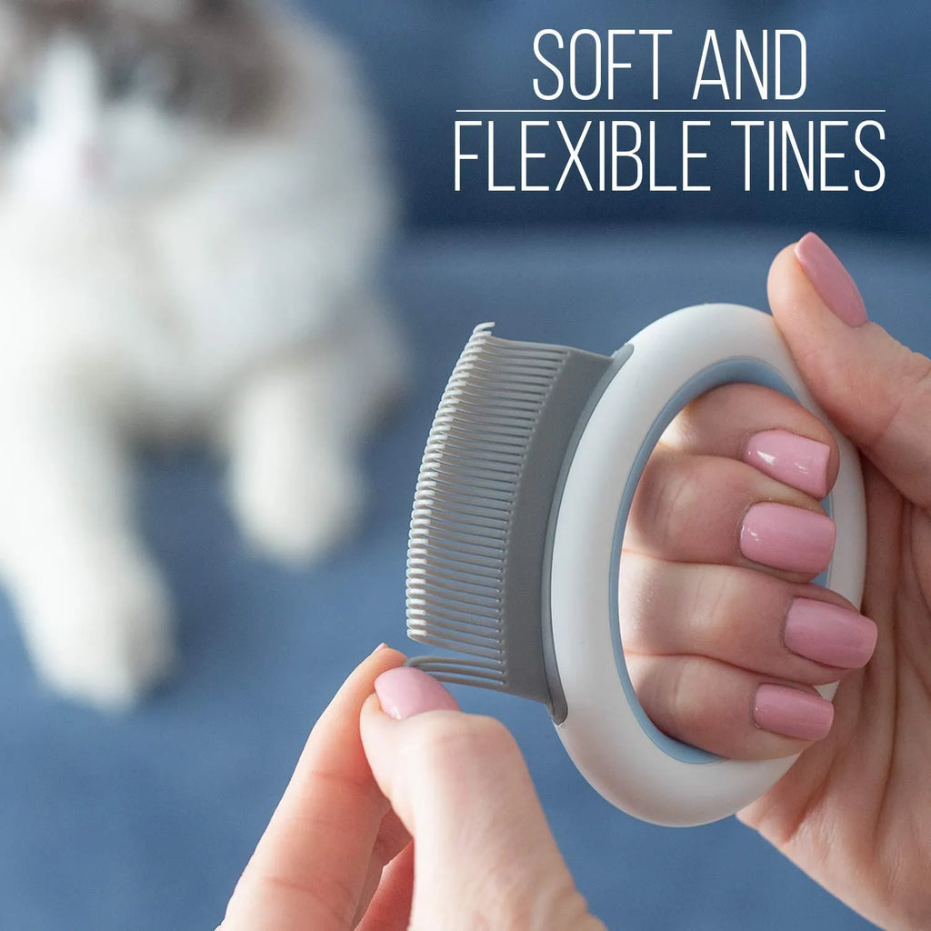 Blue pet grooming brush with soft teeth and ergonomic handle for deshedding cats and dogs.