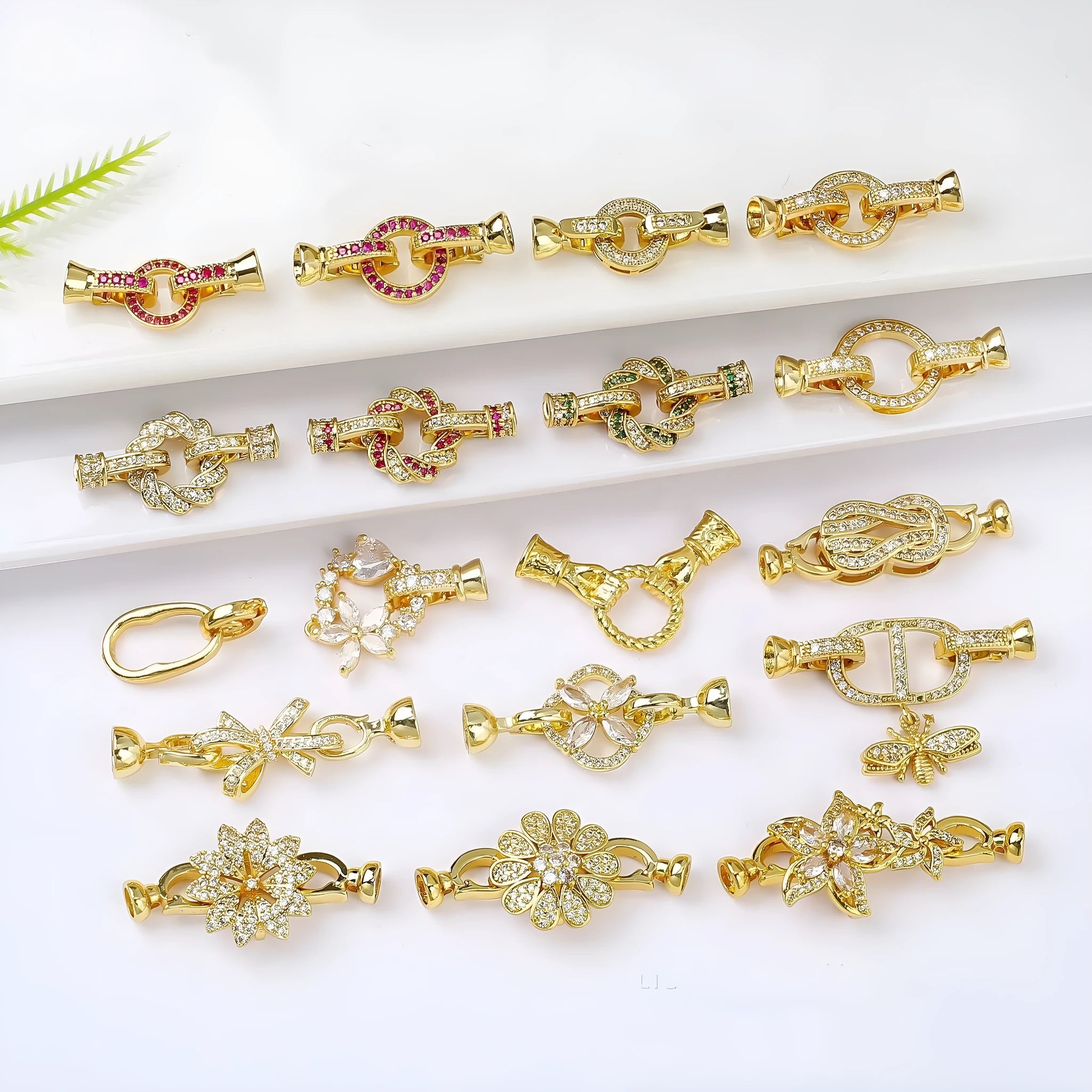 Small gold-coloured jewellery clasp buckle for necklace repair with electroplated finish
