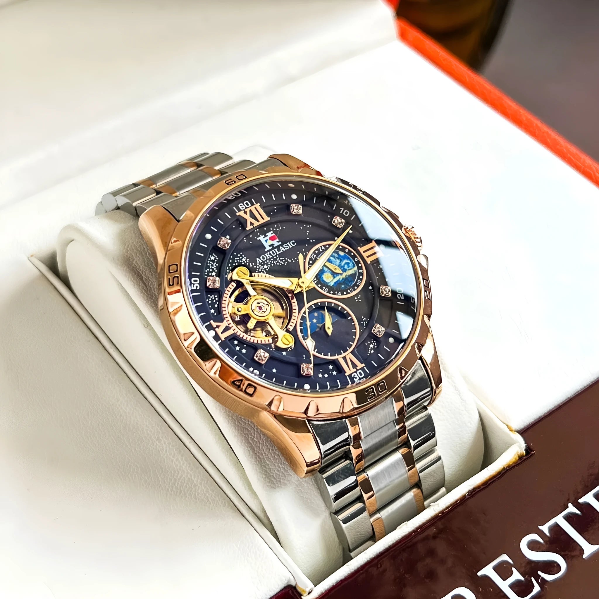 Men's automatic mechanical watch with rose gold case and black dial showing 12mm thickness