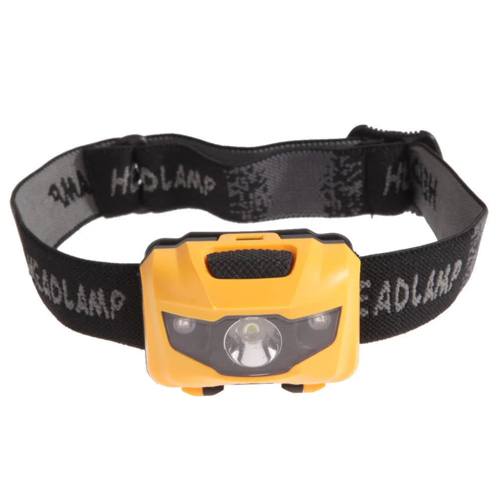 Black waterproof head torch with white and red LEDs mounted on adjustable headband for outdoor use.