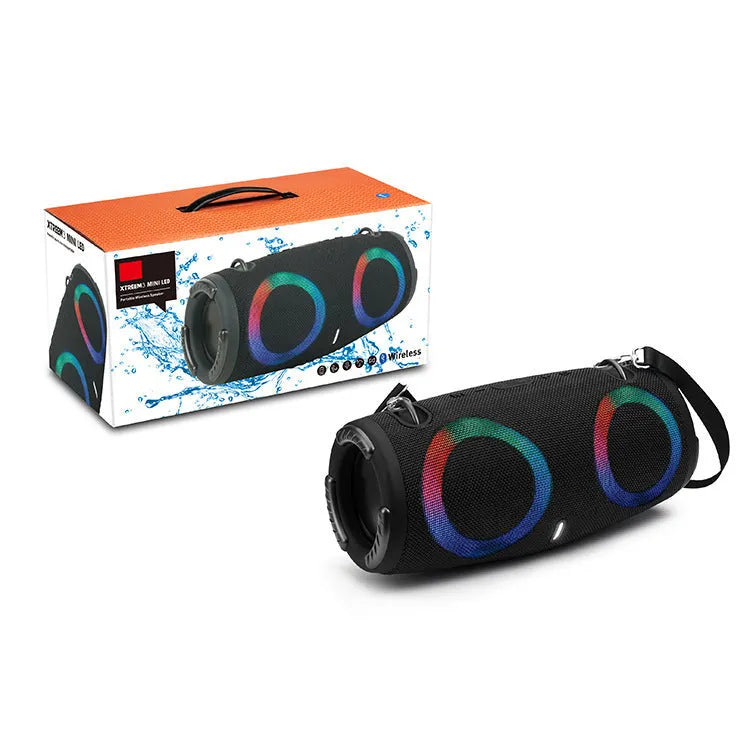 War Drum portable Bluetooth speaker with RGB lights in camouflage colour with carrying strap.