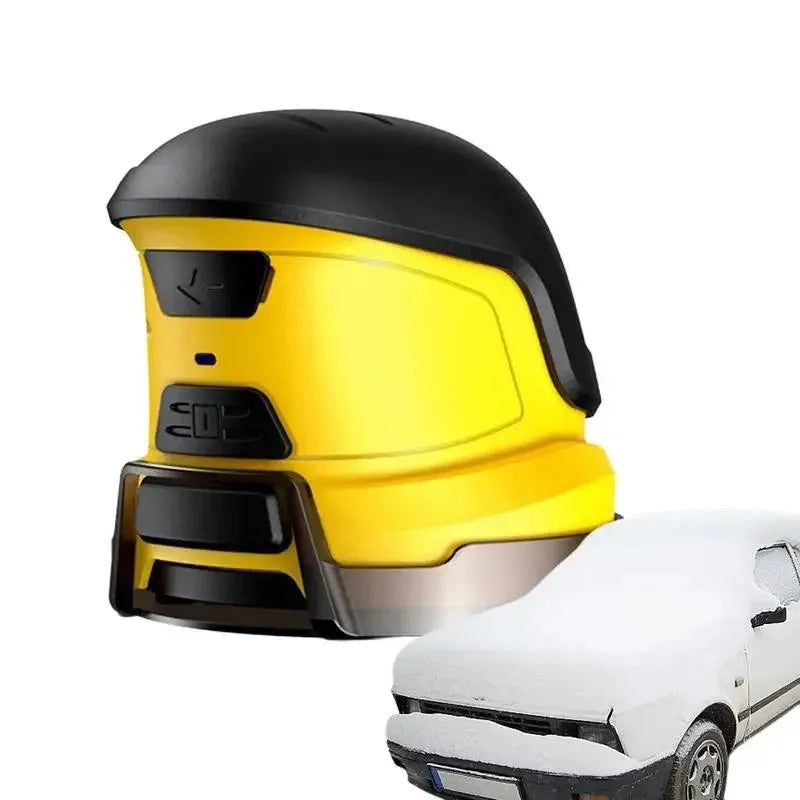 Yellow cordless electric ice scraper with USB charging cable on a car windscreen.