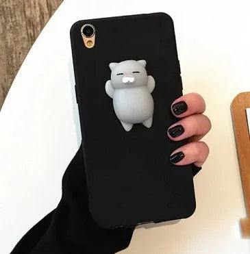 Soft pink TPU iPhone case with a raised white 3D cartoon cat design on the back.