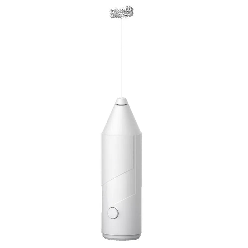 Compact black handheld USB rechargeable milk frother with stainless steel whisk on a kitchen counter.