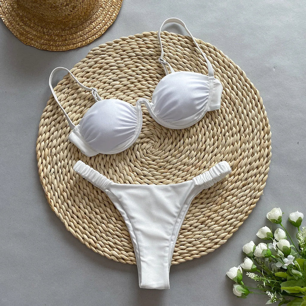 Women's black underwire bikini swimsuit set with split briefs on a neutral background.