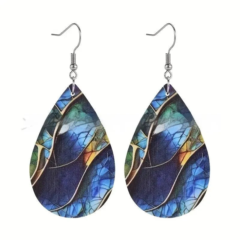 Clear acrylic drop earrings with flat branch knot design, front view