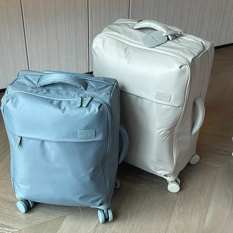 Ultra-light waterproof Oxford cloth suitcase with universal wheels in bluestone green colour.