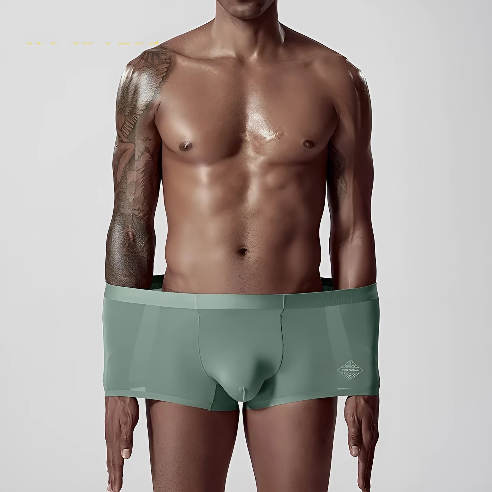 Men's modal seamless underwear in green colour showing mid waist design and solid pattern