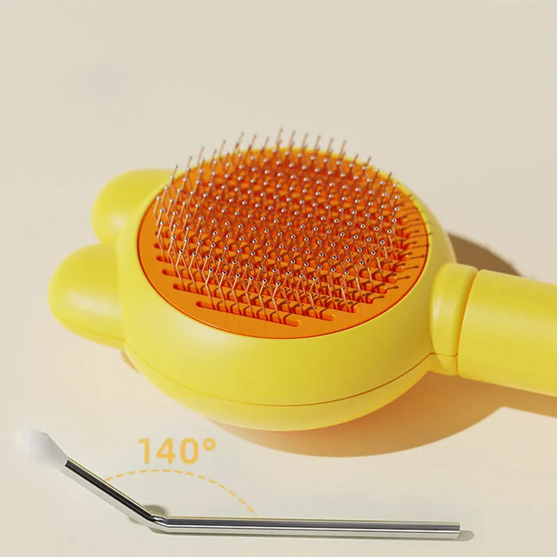 Green pet grooming brush with metal comb and release button on a non-slip handle