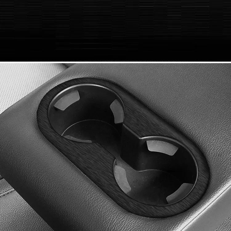 Car interior decorative vinyl sticker kit showing pre-cut pieces for dashboard, centre console and trim